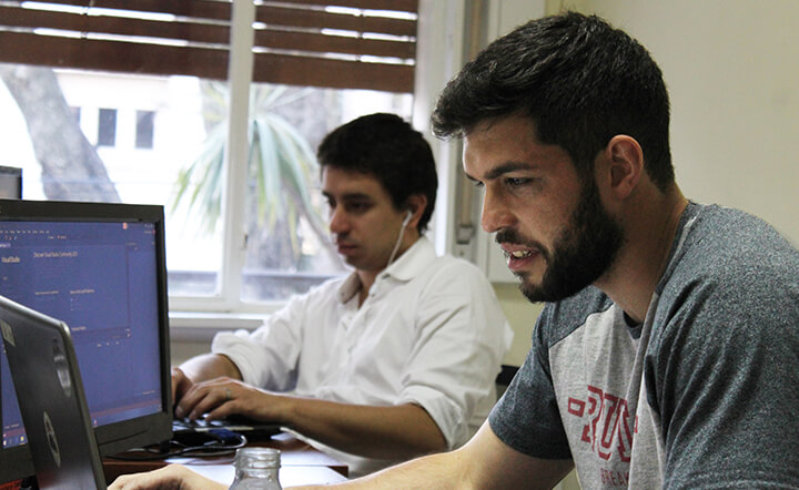 photo of two men programming